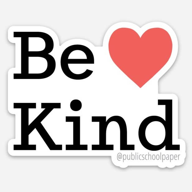 A die-cut sticker with the words 'Be Kind' in black serif lettering and a red heart symbol replacing the letter 'o' in 'kind'. A small '@publicschoolpaper' handle appears at the bottom right.