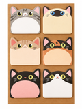 Six square sticky notes with cute cartoon cat faces, arranged in a 3x2 grid on a brown kraft paper backing. The cats feature various colors including gray, beige, pink, orange, black, and white.
